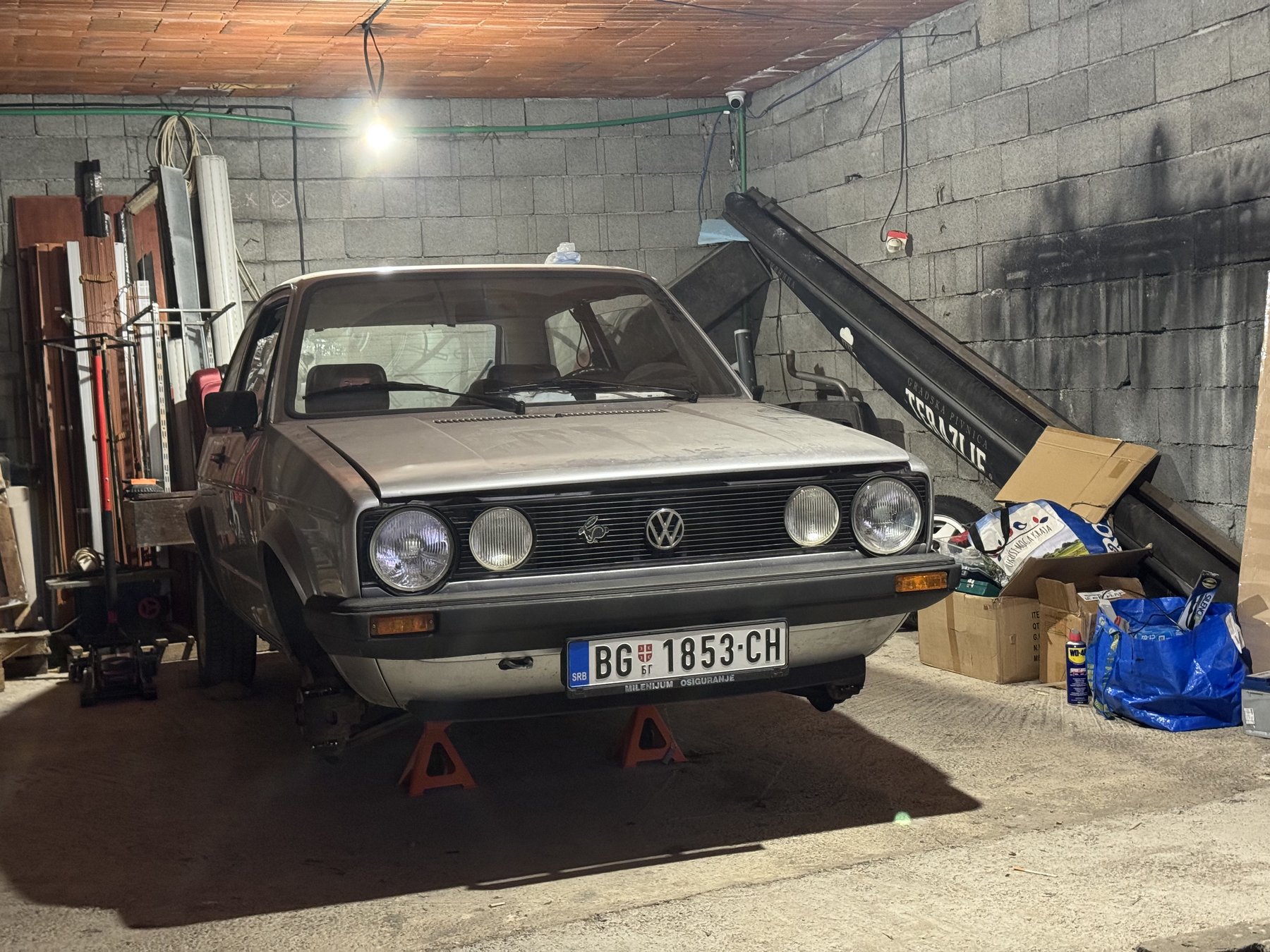 Golf Mk1 on stands in a garage during restoration